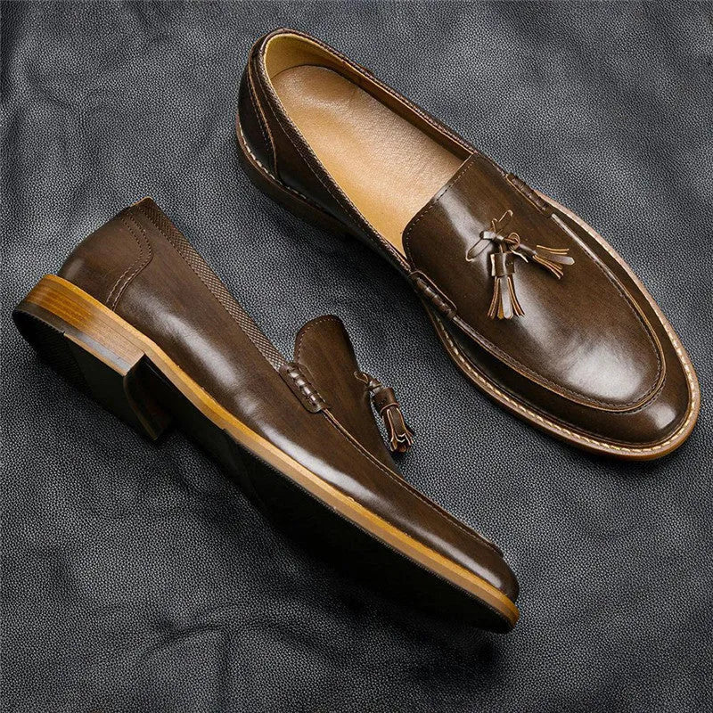 Men's brown formal leather loafers with tassels, PU upper, composite sole, low-cut round toe design on a clean background