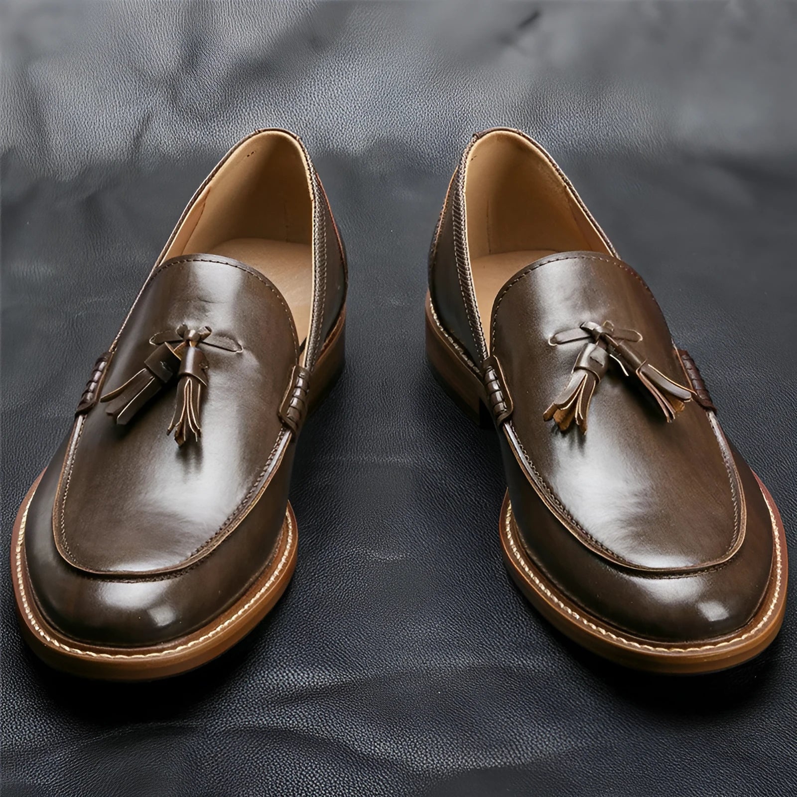 Men's brown formal leather loafers with tassels, PU upper, composite sole, low-cut round toe design on a clean background
