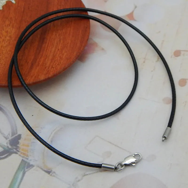 Adjustable black wax rope lanyard necklace with a gold stainless steel buckle shown at various lengths.