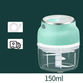 Portable white electric food chopper with transparent cup and stainless steel blades on a kitchen counter.