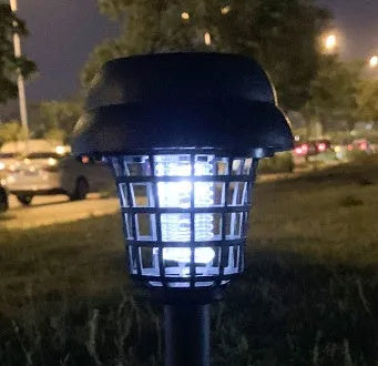 White and purple solar-powered mosquito killer lamp for outdoor garden and camping use.