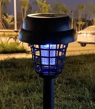 White and purple solar-powered mosquito killer lamp for outdoor garden and camping use.