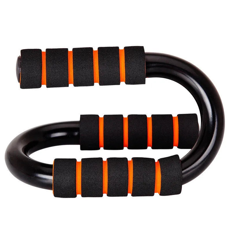 Black parallettes push up stands made of steel pipe with foam grips, 19x13x13cm, on a flat surface