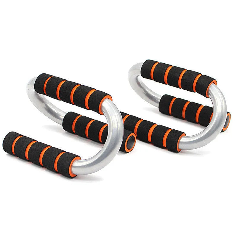 Black parallettes push up stands made of steel pipe with foam grips, 19x13x13cm, on a flat surface