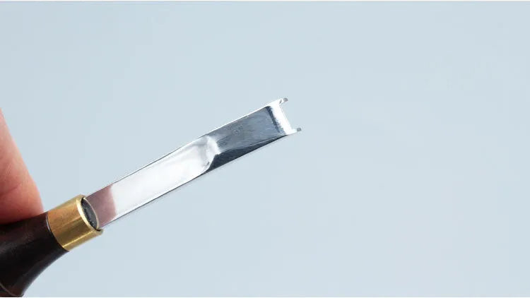 Sectional wide shovel edge leather thinning knife for edge bevelling.