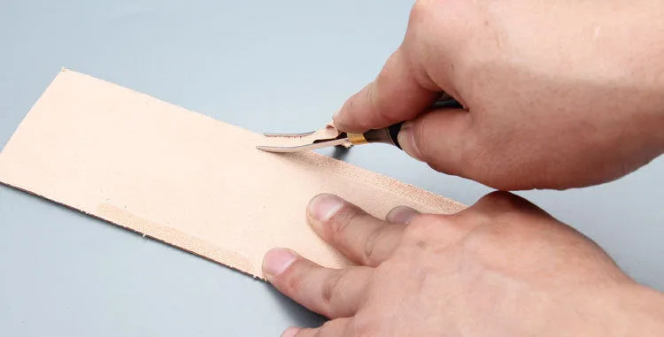 Sectional wide shovel edge leather thinning knife for edge bevelling.