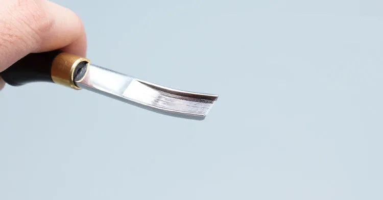 Sectional wide shovel edge leather thinning knife for edge bevelling.