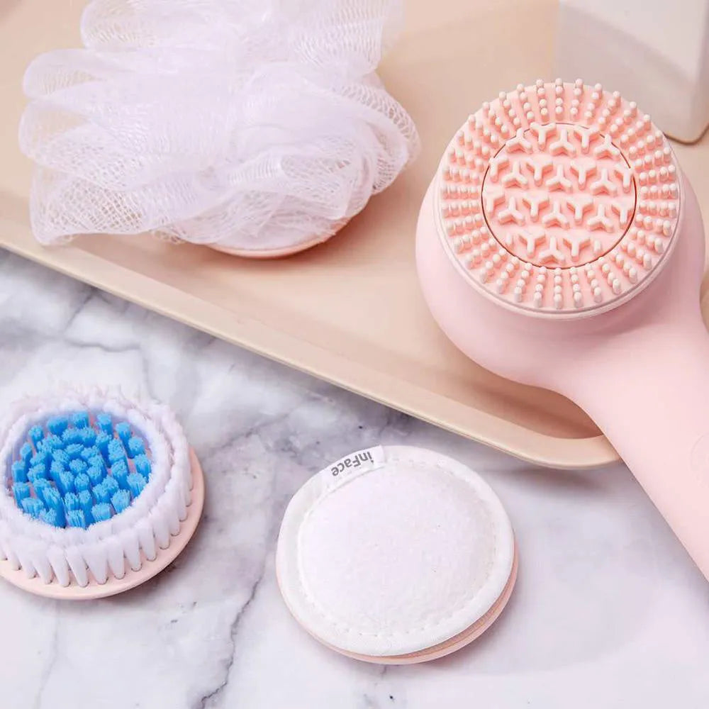Grey and pink inFace automatic electric shower brush with four rotating brush heads on display.