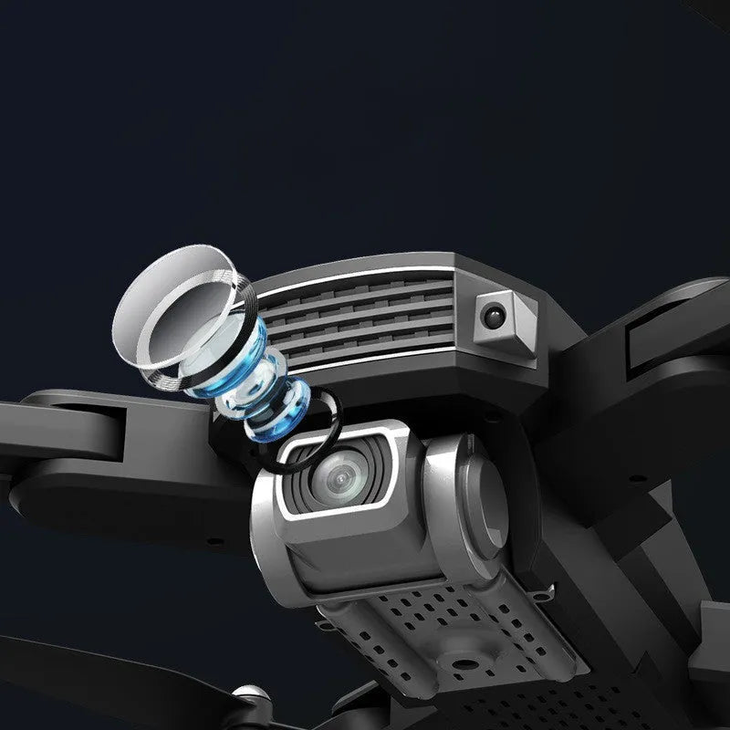 Black and red folding quadcopter drone with 4K camera and remote control handle on a table.