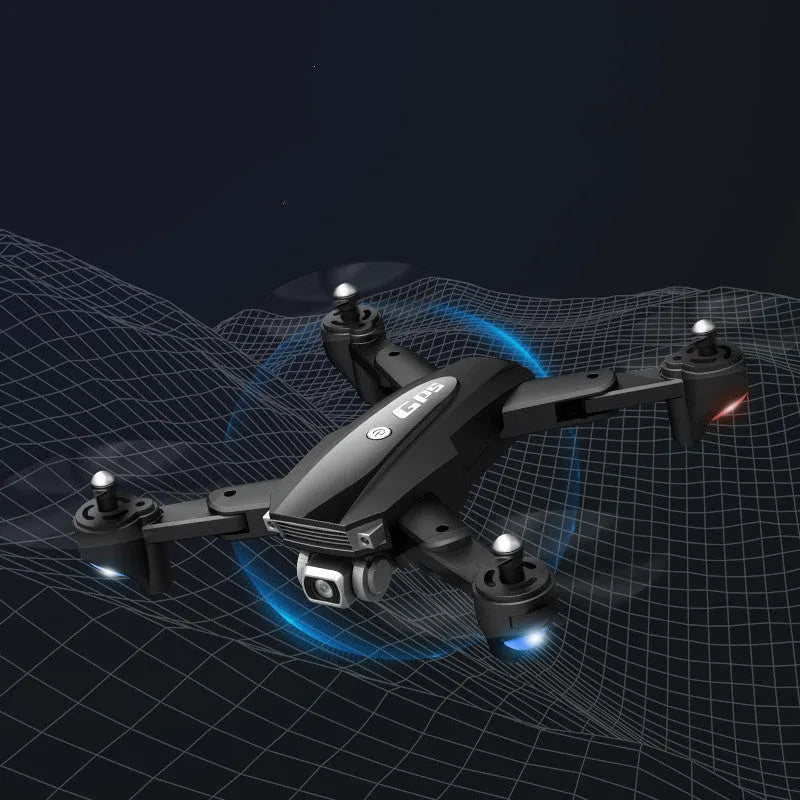 Black and red folding quadcopter drone with 4K camera and remote control handle on a table.