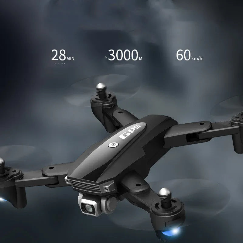 Black and red folding quadcopter drone with 4K camera and remote control handle on a table.