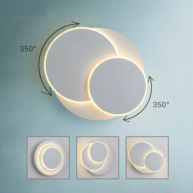 Modern round acrylic wall lamp in black or white, shown in small, medium, and large size options.