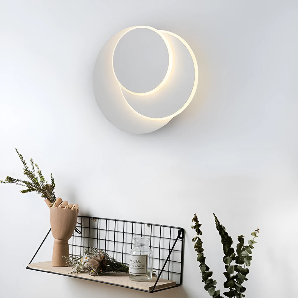 Modern round acrylic wall lamp in black or white, shown in small, medium, and large size options.
