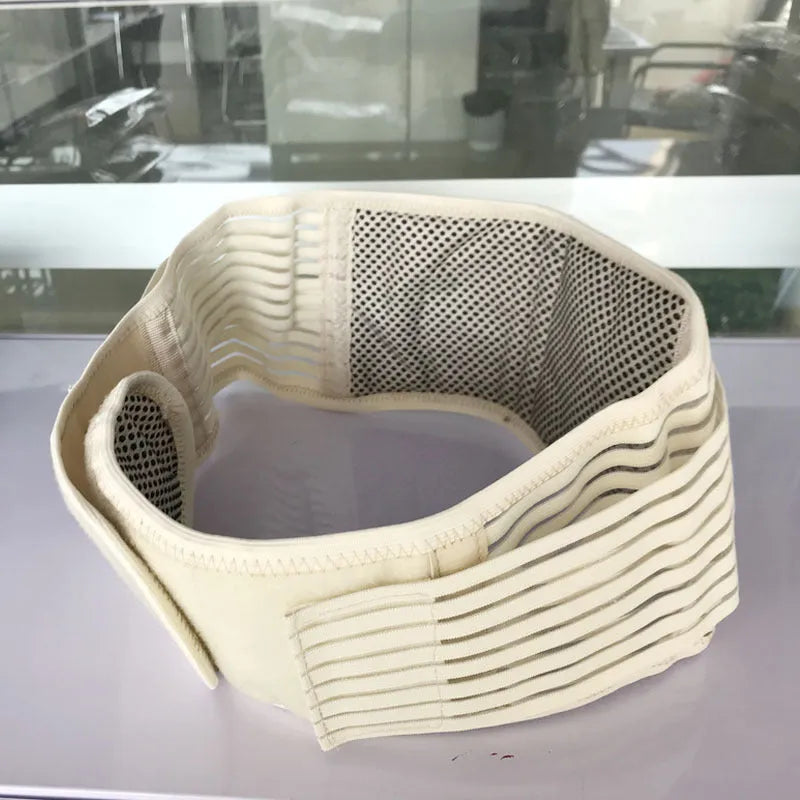 Beige self-heating lumbar support belt with magnetic therapy, shown fastened around a waist.