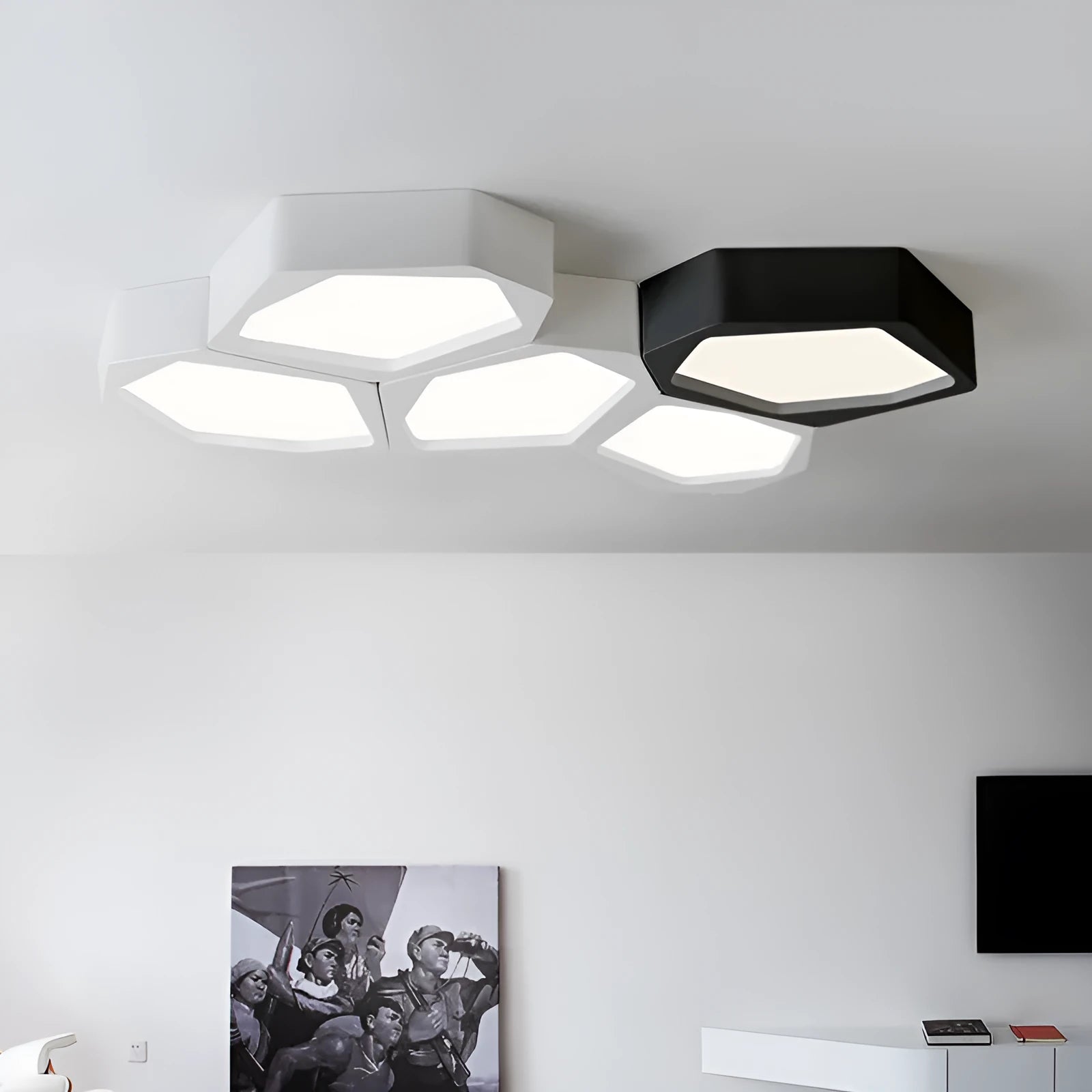 Geometric shaped iron shade LED light fixture with remote control in black or white frame.