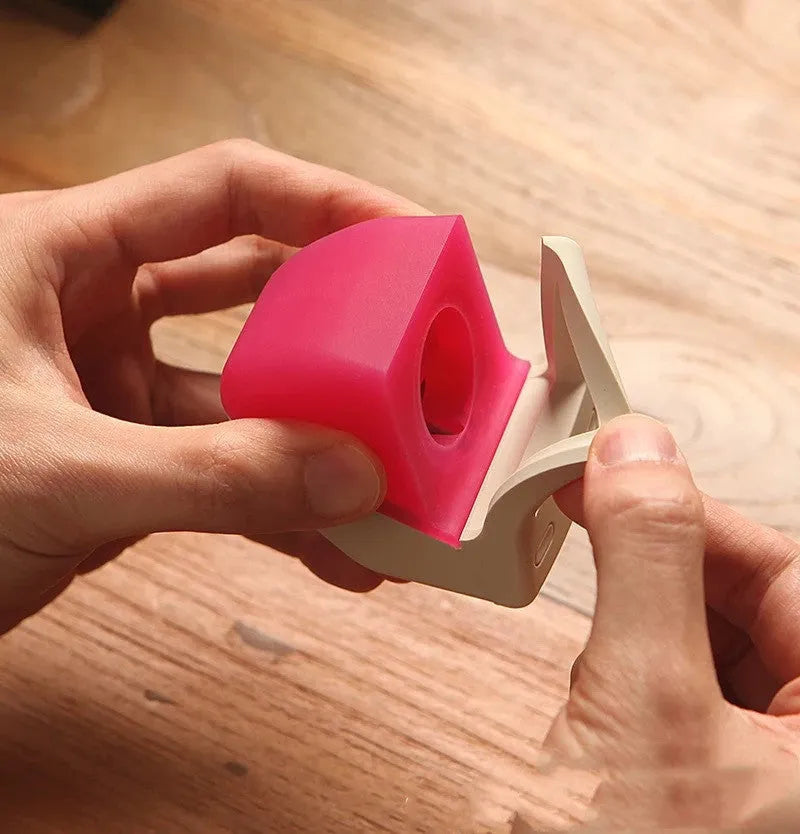 Silicone Apple Watch charging stand in Mint Green, holding a watch in upright position on a desk