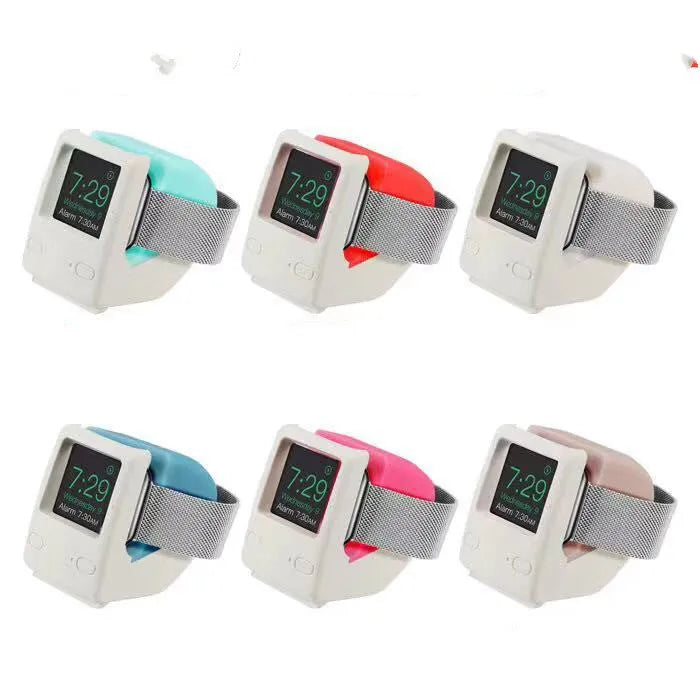 Silicone Apple Watch charging stand in Mint Green, holding a watch in upright position on a desk