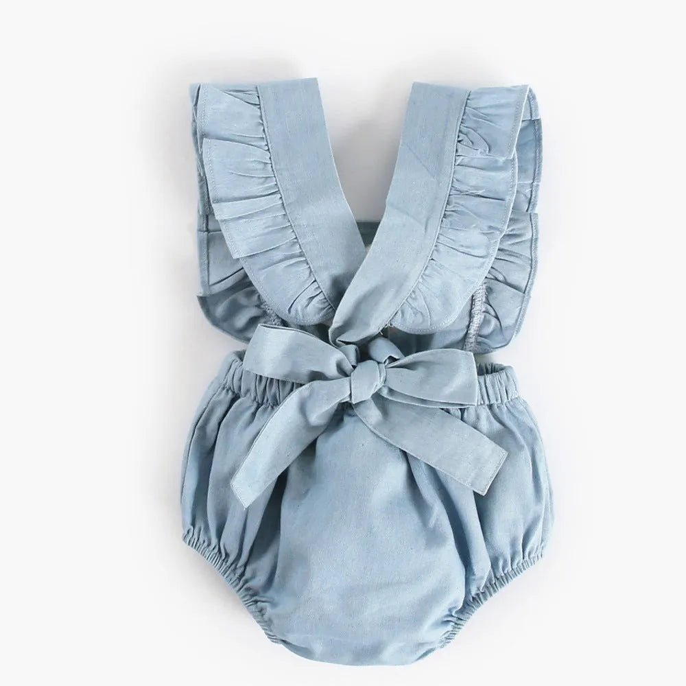 Blue denim lace sleeveless baby romper bodysuit with princess styling on a hanger.