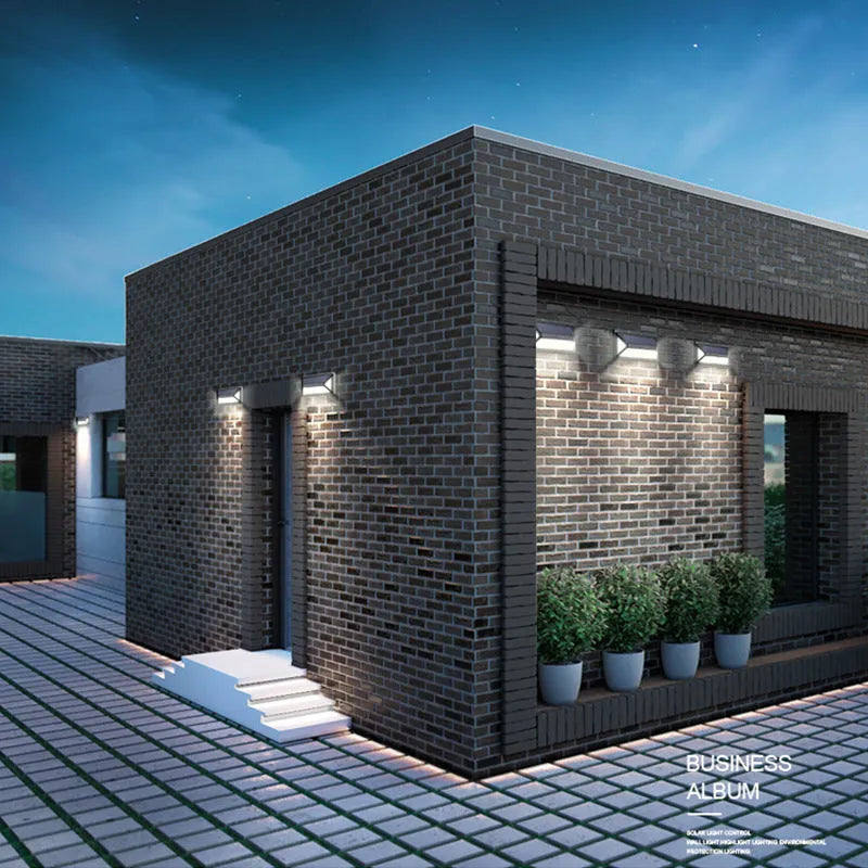 Black solar wall light with 33 LEDs, IP65 rated, measuring 166x75x30mm, mounted on an exterior wall