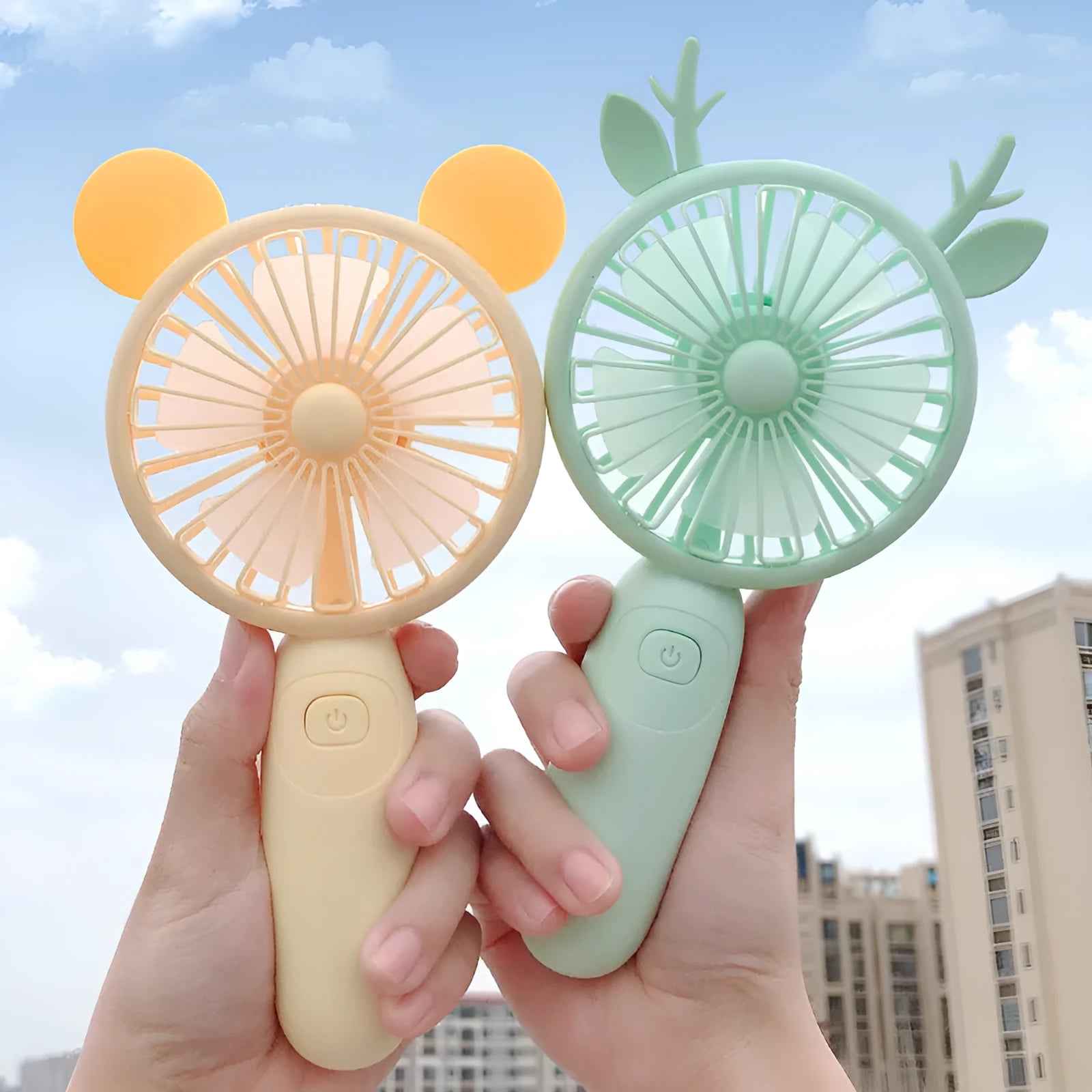 Hand-held USB charging fan in blue, green, pink or yellow cartoon colours for student use