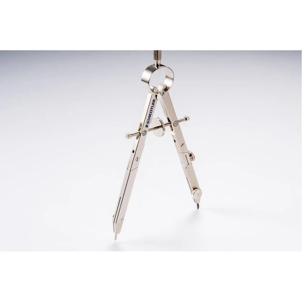 STAEDTLER 551 01 metal car compass with extended telescopic rod on technical drawing paper.