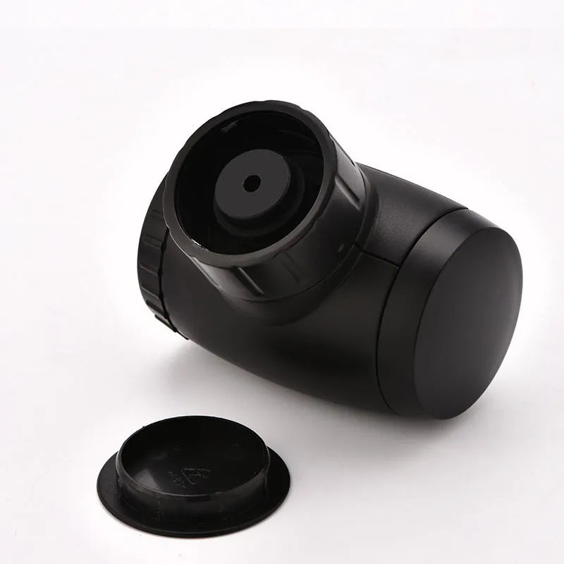 Black rechargeable electric vacuum wine stopper with charging cable.