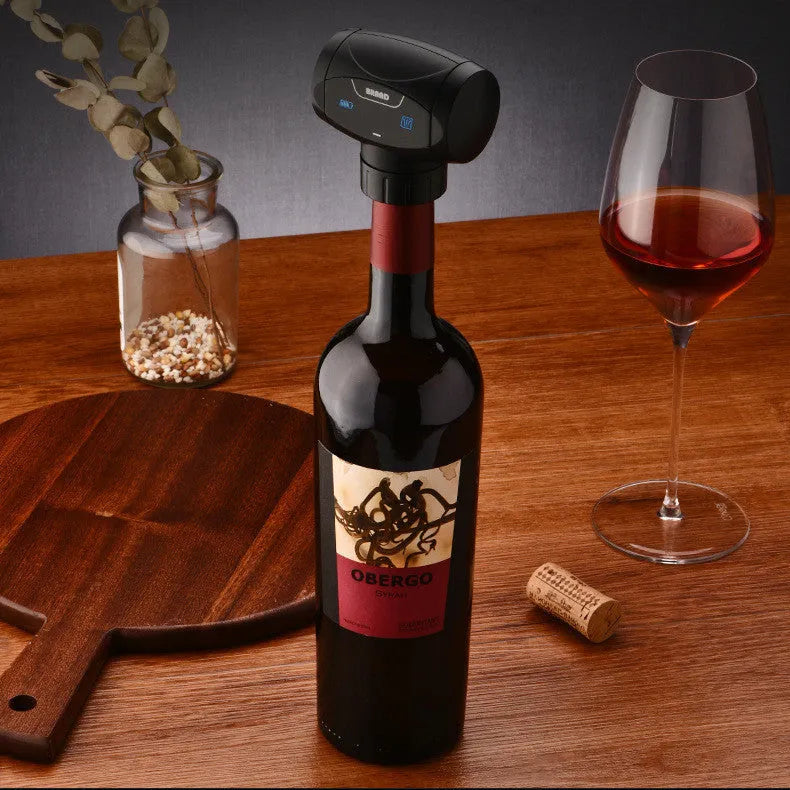 Black rechargeable electric vacuum wine stopper with charging cable.