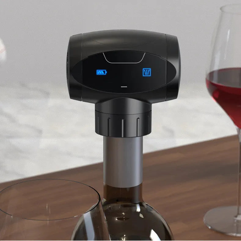 Black rechargeable electric vacuum wine stopper with charging cable.