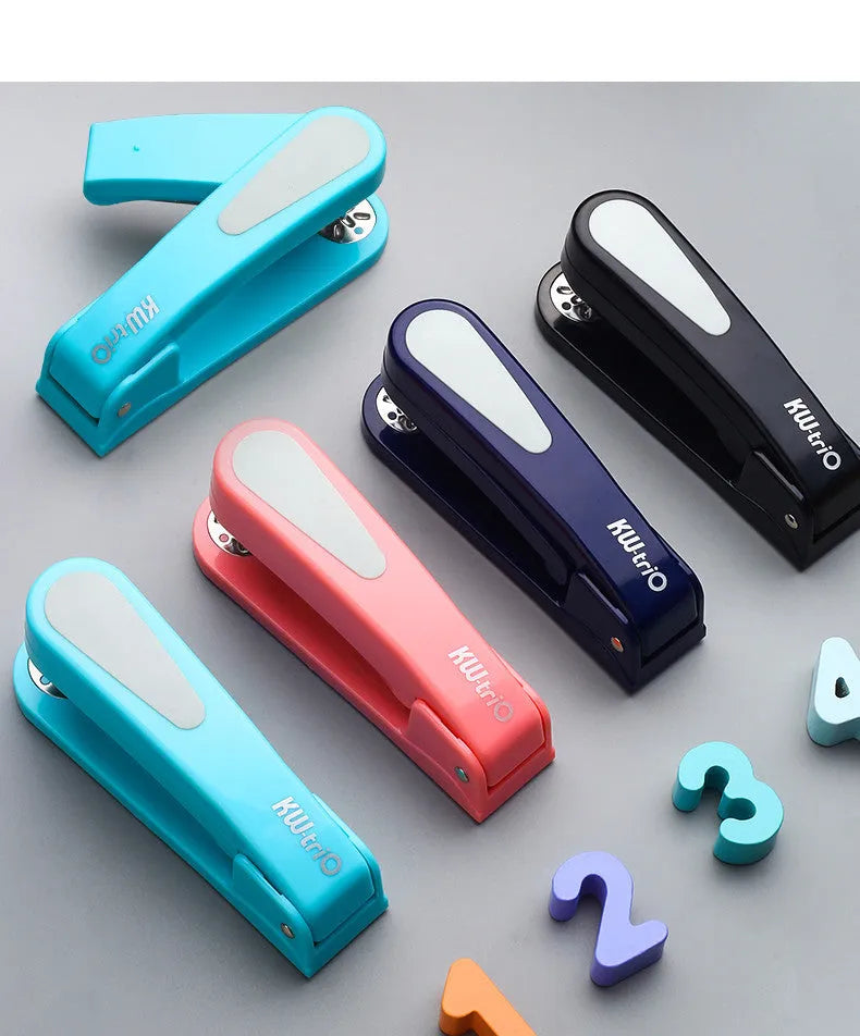Black 360-degree rotatable desk stapler showing metal nail outlet and centre seam binding function.