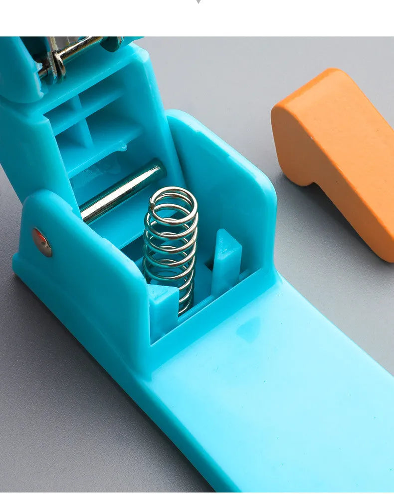 360-degree rotatable stapler in dark blue on a desk with papers, showing its rotating head mechanism.