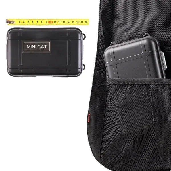 13-piece black stainless steel survival treasure box with tools including flashlight, compass, wire saw, and survival blanket