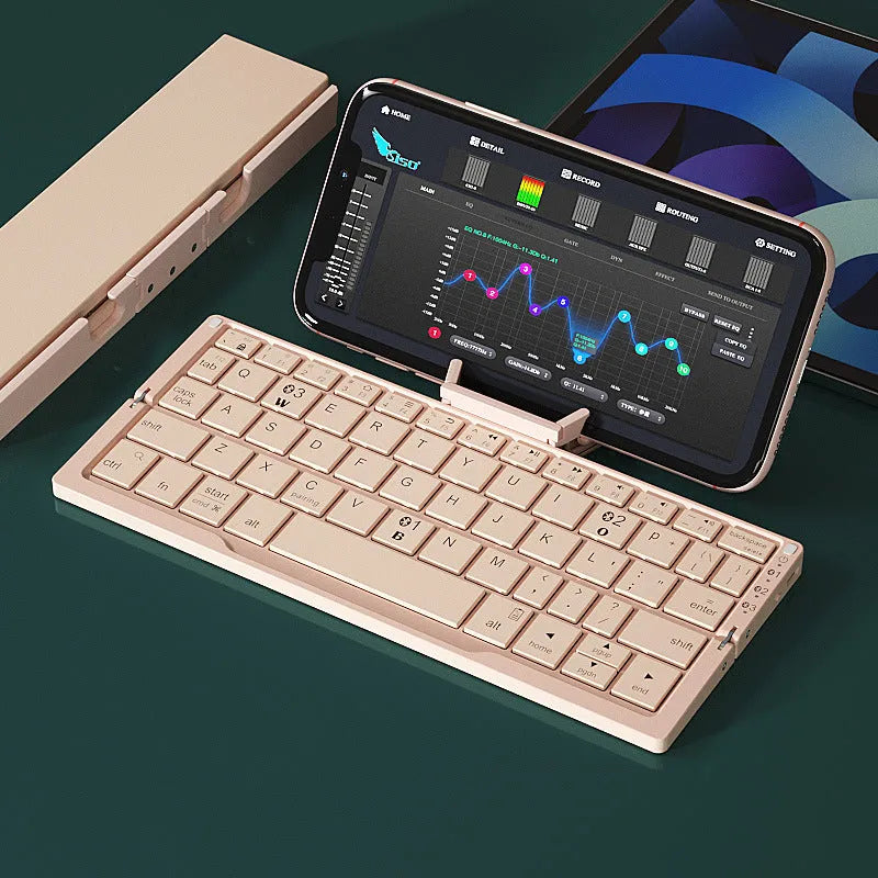 Silver aluminium folding Bluetooth keyboard shown open with phone on stand and folded to pocket size