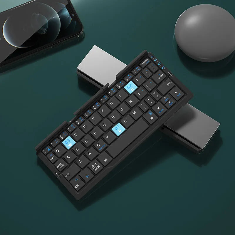 Silver aluminium folding Bluetooth keyboard shown open with phone on stand and folded to pocket size
