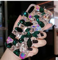 Clear rhinestone decorated iPhone case on mobile phone showing sparkling elements and transparent TPU construction