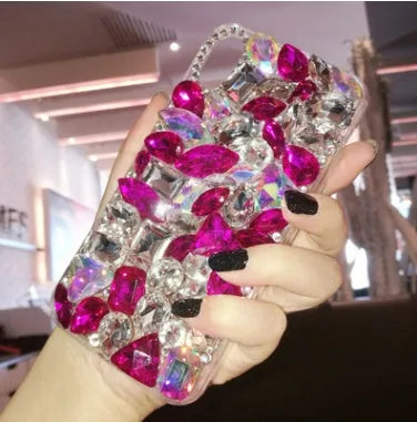 Clear rhinestone decorated iPhone case on mobile phone showing sparkling elements and transparent TPU construction