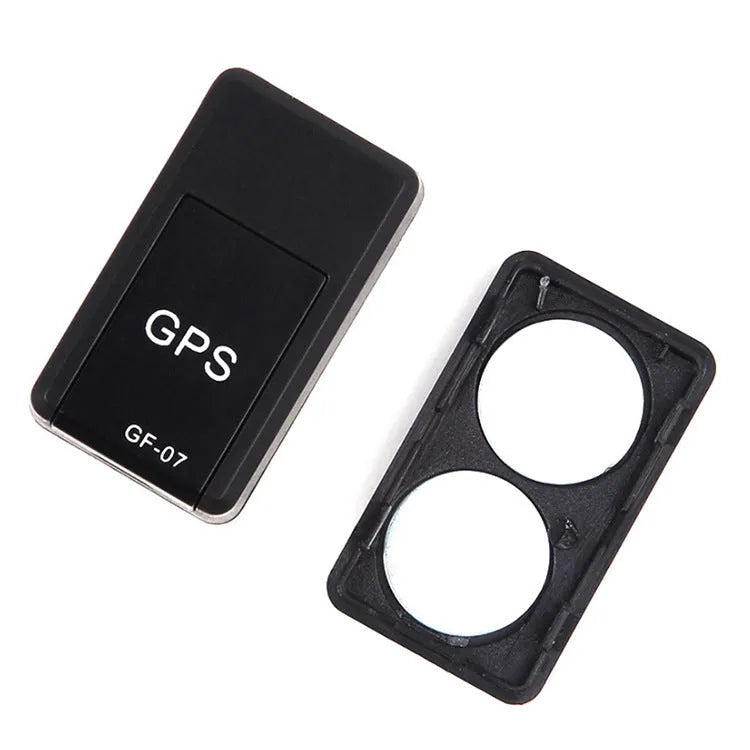 Small black magnetic GPS tracker device with USB cable for real-time vehicle and asset tracking.