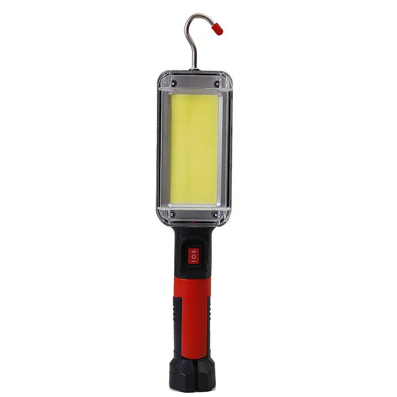 Black portable COB LED flashlight with a magnetic strip on the base and a USB charging port.