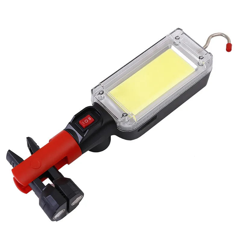 Black portable COB LED flashlight with a magnetic strip on the base and a USB charging port.