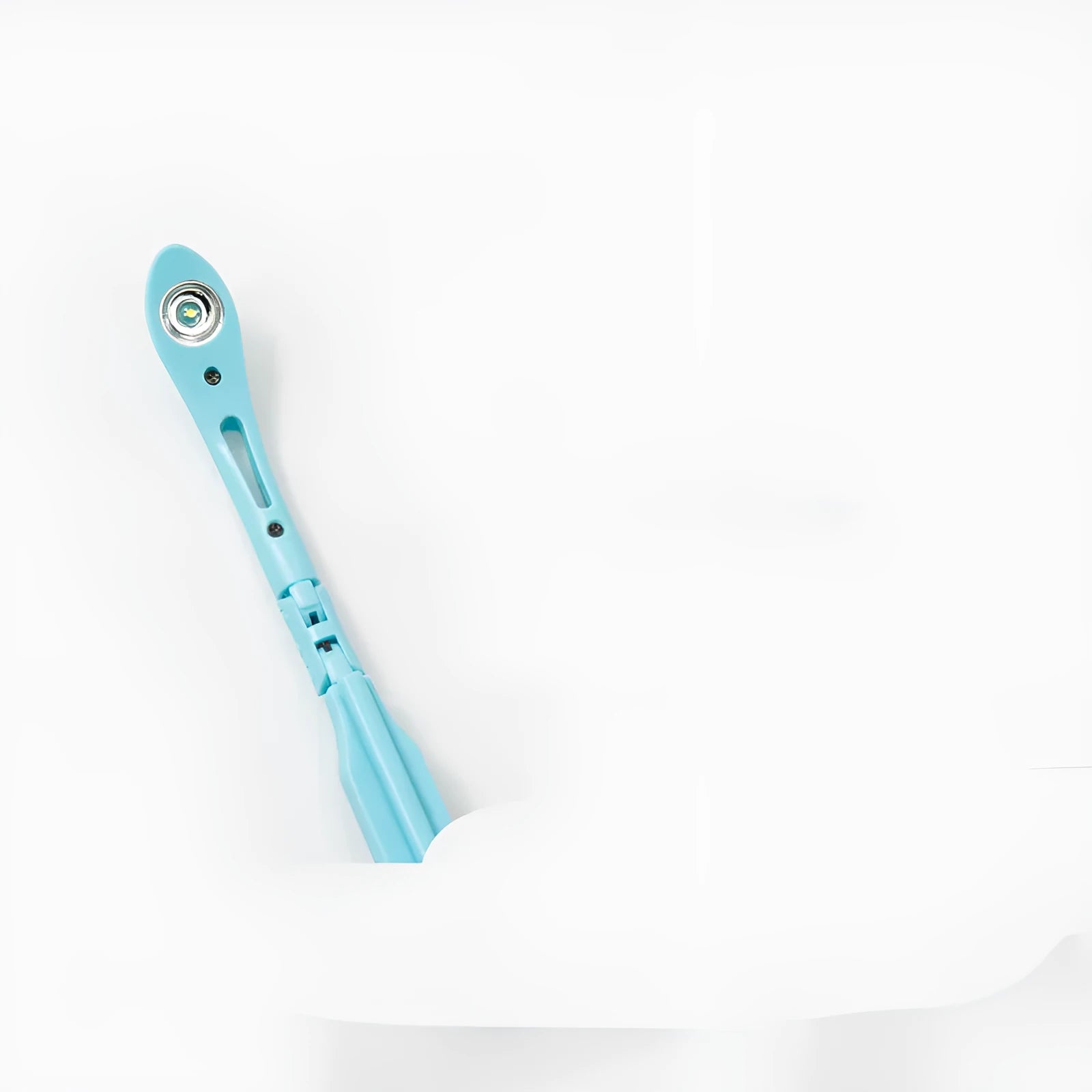 A folding book light with a clip, shown in yellow, blue, green, and pink colour options.