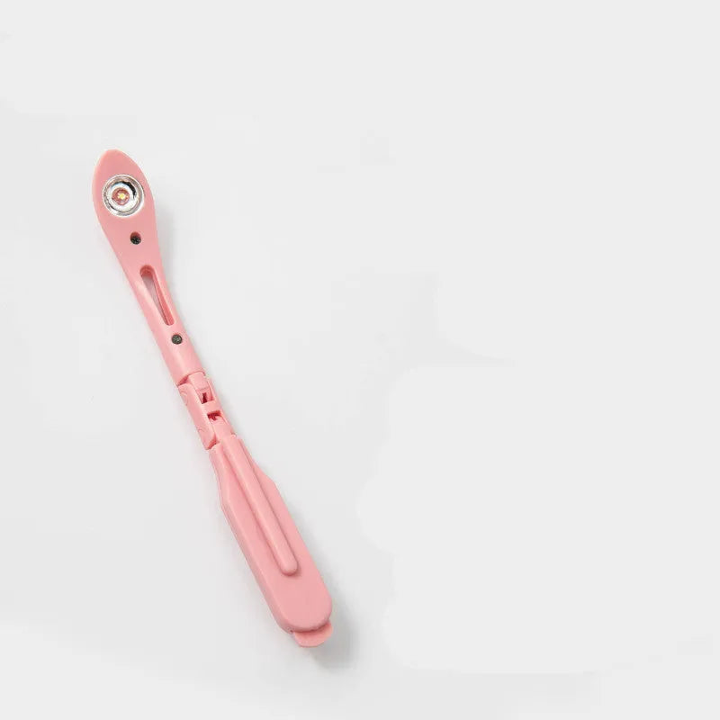 A folding book light with a clip, shown in yellow, blue, green, and pink colour options.