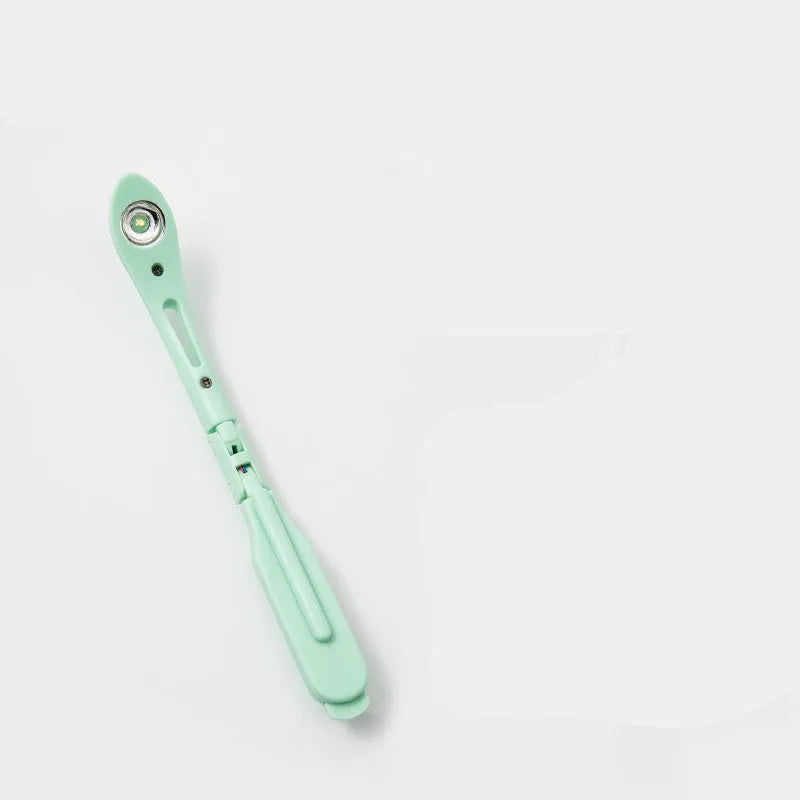 A folding book light with a clip, shown in yellow, blue, green, and pink colour options.