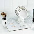 Double tier iron dish rack with removable upper layer and bottom drain tray in white, holding bowls and plates