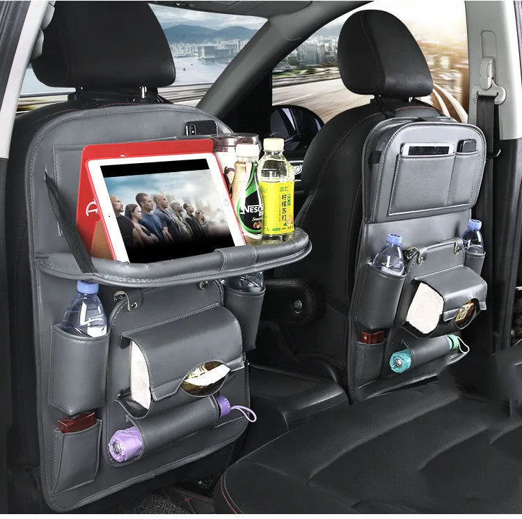 PU leather car seat back organiser with multiple pockets and a detachable bottom waste bin, hanging behind a car headrest.
