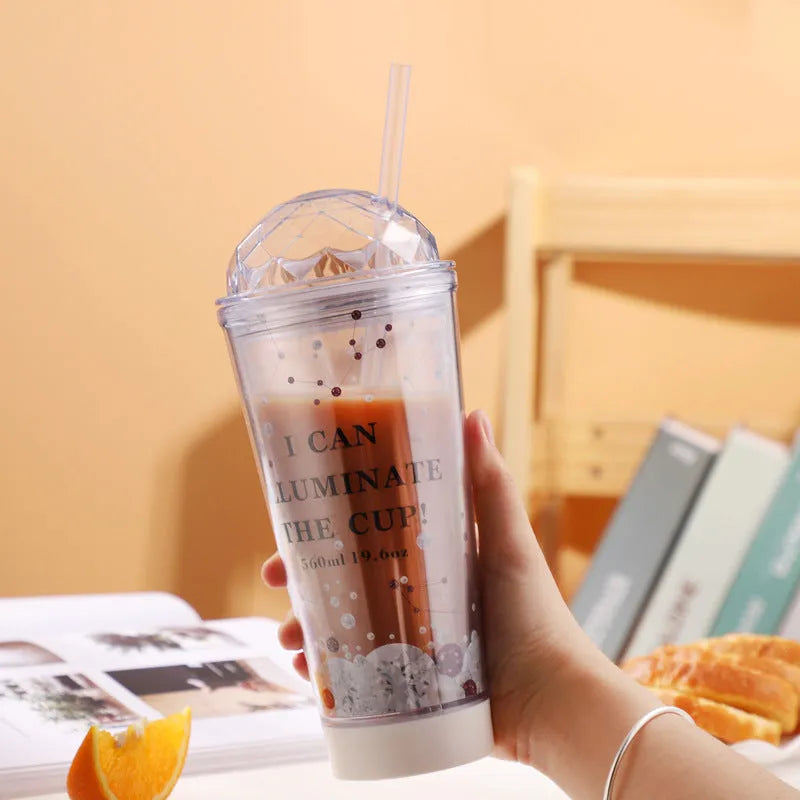 Luminous creative plastic cup with light gradient colour change in blue with double straw and lid