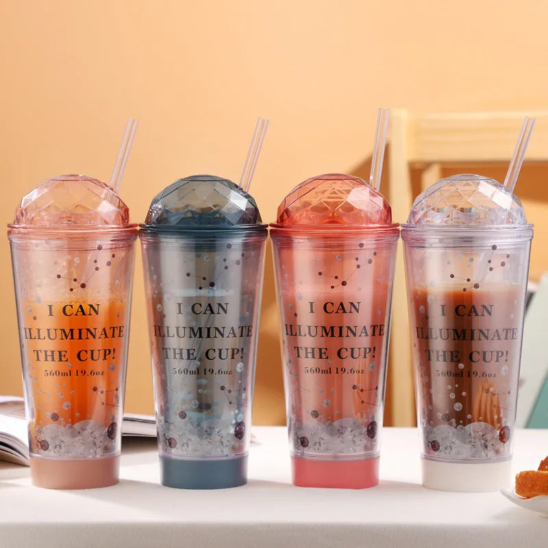 Luminous creative plastic cup with light gradient colour change in blue with double straw and lid