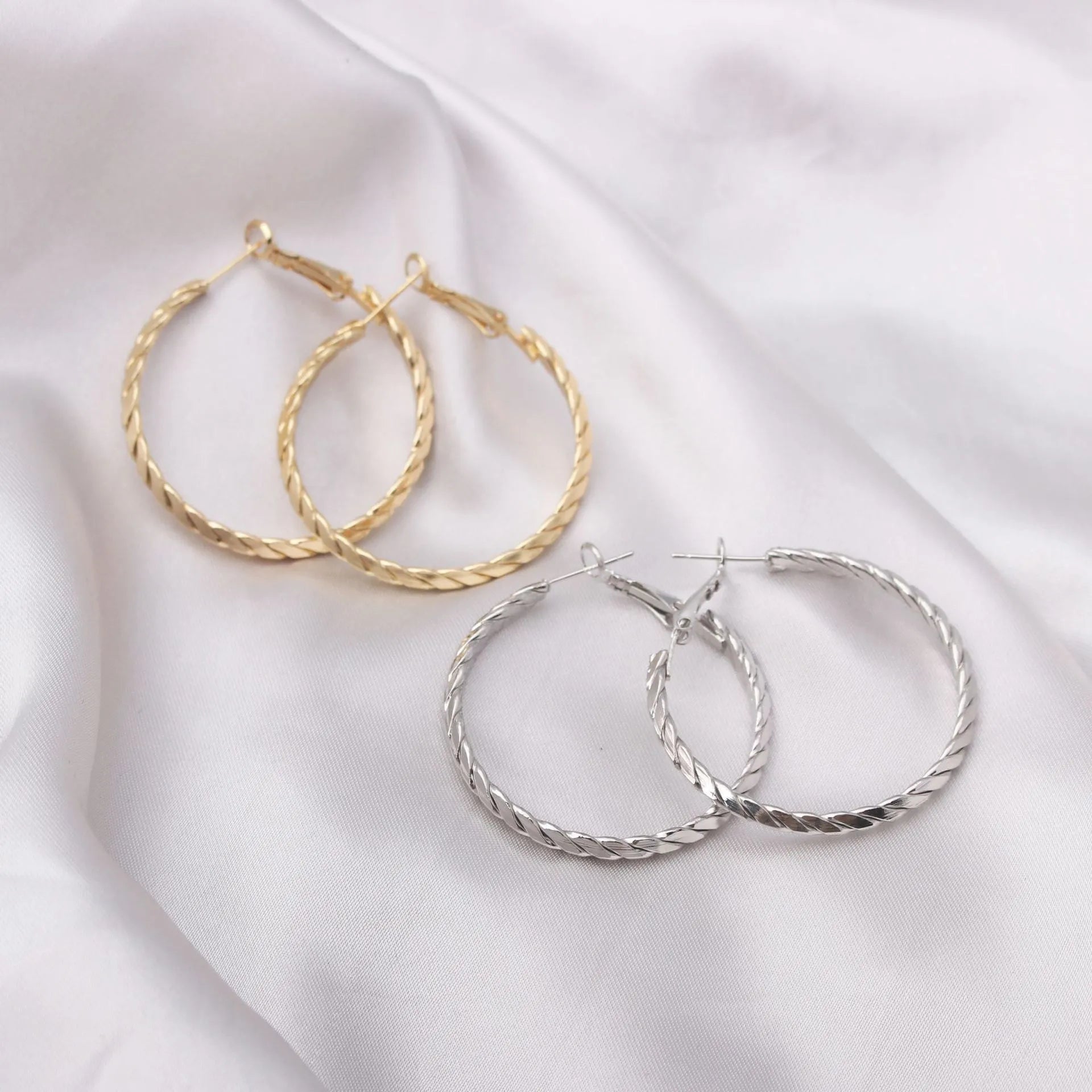 Simple geometric metal earrings for women in golden colour with electroplating finish