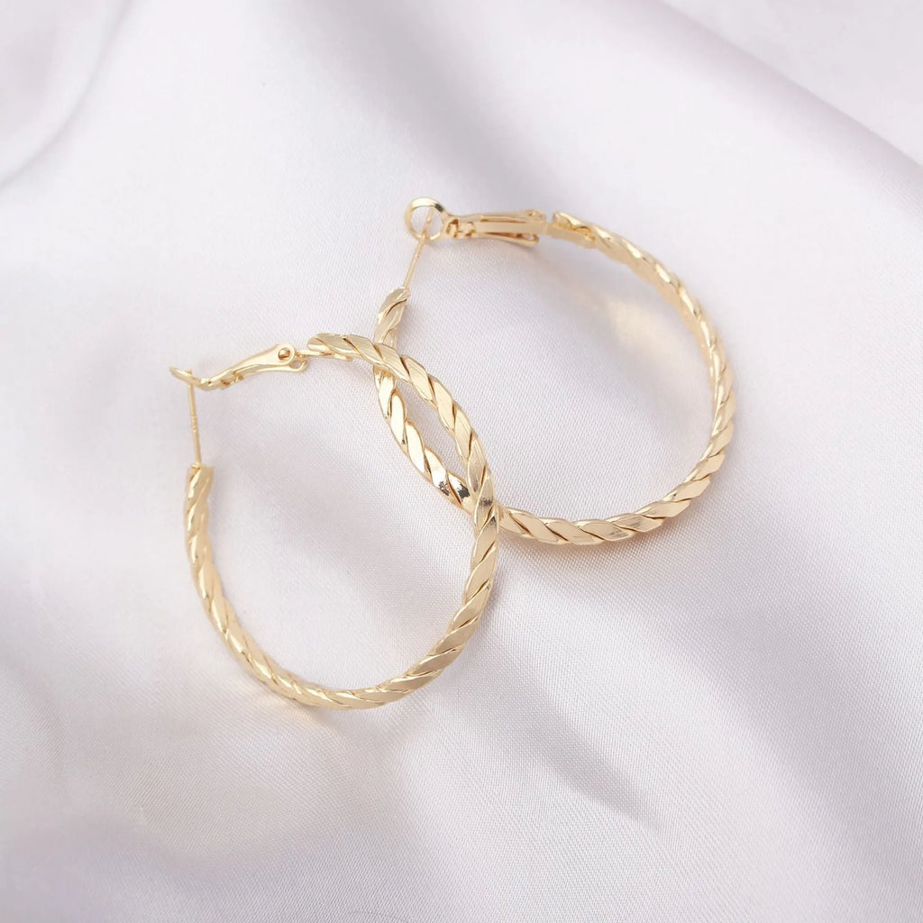 Simple geometric metal earrings for women in golden colour with electroplating finish