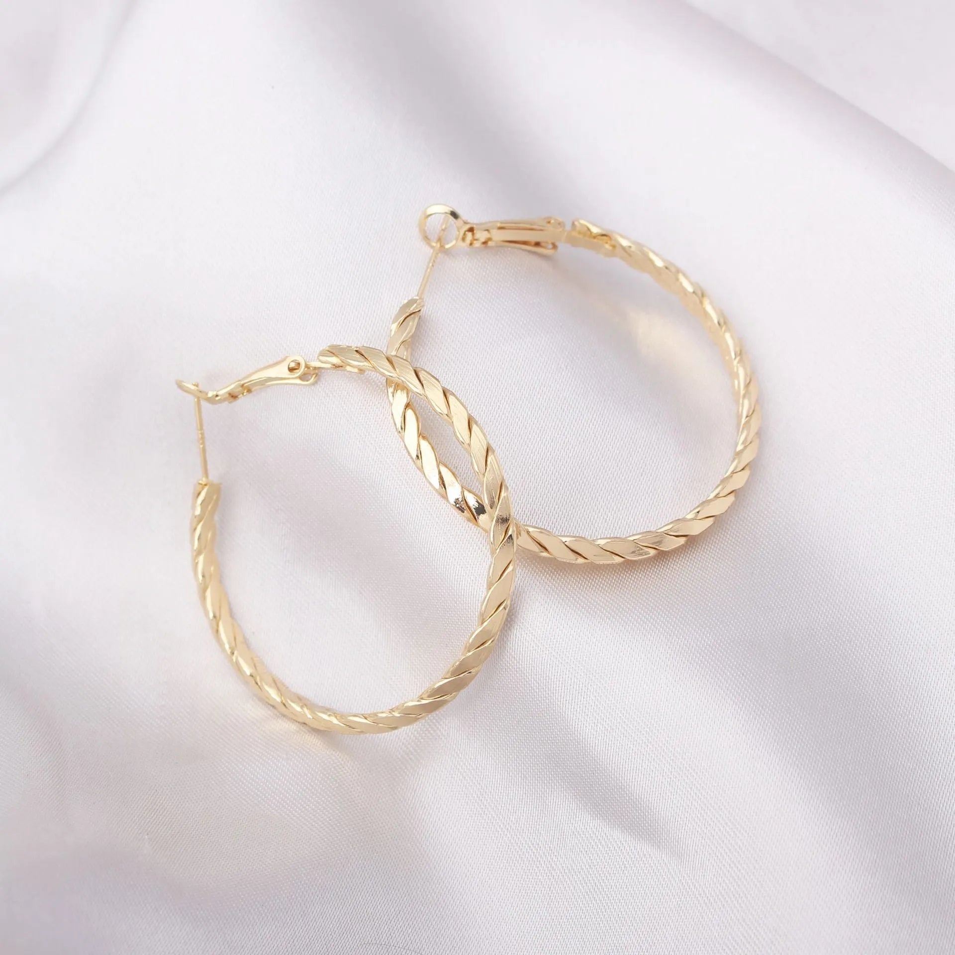 Simple geometric metal earrings for women in golden colour with electroplating finish