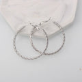 Simple geometric metal earrings for women in golden colour with electroplating finish