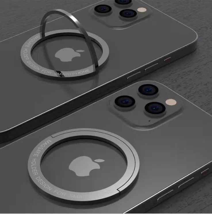 Round zinc alloy mobile phone holder on a desk, 56mm diameter, available in black or silver